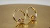RGAÉL™ Setting gemstone earrings featuring a radiant citrine center gemstone and brilliant-cut tanzanite accent stones, reflecting light with refined elegance and meaningful design.